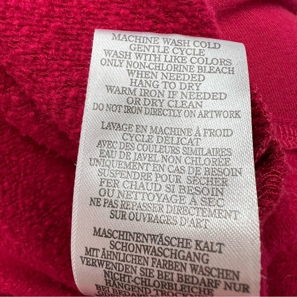 Peloton cranberry colored lightweight sweatshirt with multi-color brand name. - Picture 8 of 8
